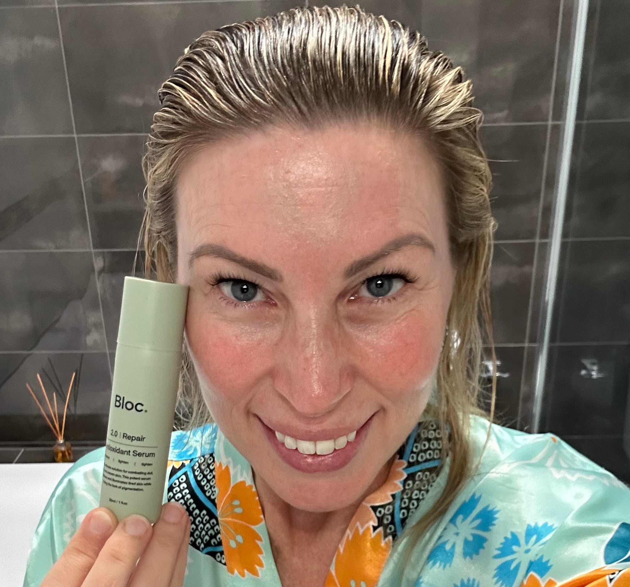 Applying Bloc Antioxidant Serum to the face